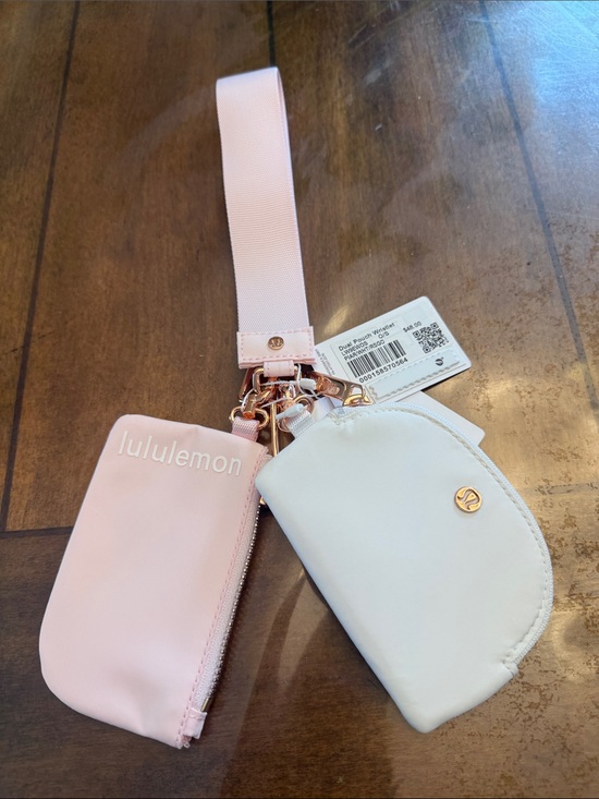 lululemon athletica Handbags - *NWT* Lululemon athletica Pink and White Rose Gold Wristlet set-